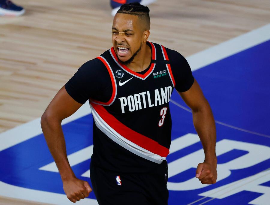 C.J. McCollum fights through back pain to ensure Blazers playoff spot