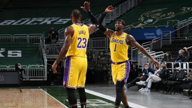 MILWAUKEE, WI - JANUARY 21: LeBron James #23 and Kentavious Caldwell-Pope #1 of the Los Angeles Lakers hi-five during the game against the Milwaukee Bucks on January 21, 2021 at the Fiserv Forum Center in Milwaukee, Wisconsin. NOTE TO USER: User expressly acknowledges and agrees that, by downloading and or using this Photograph, user is consenting to the terms and conditions of the Getty Images License Agreement. Mandatory Copyright Notice: Copyright 2021 NBAE (Photo by Gary Dineen/NBAE via Getty Images).