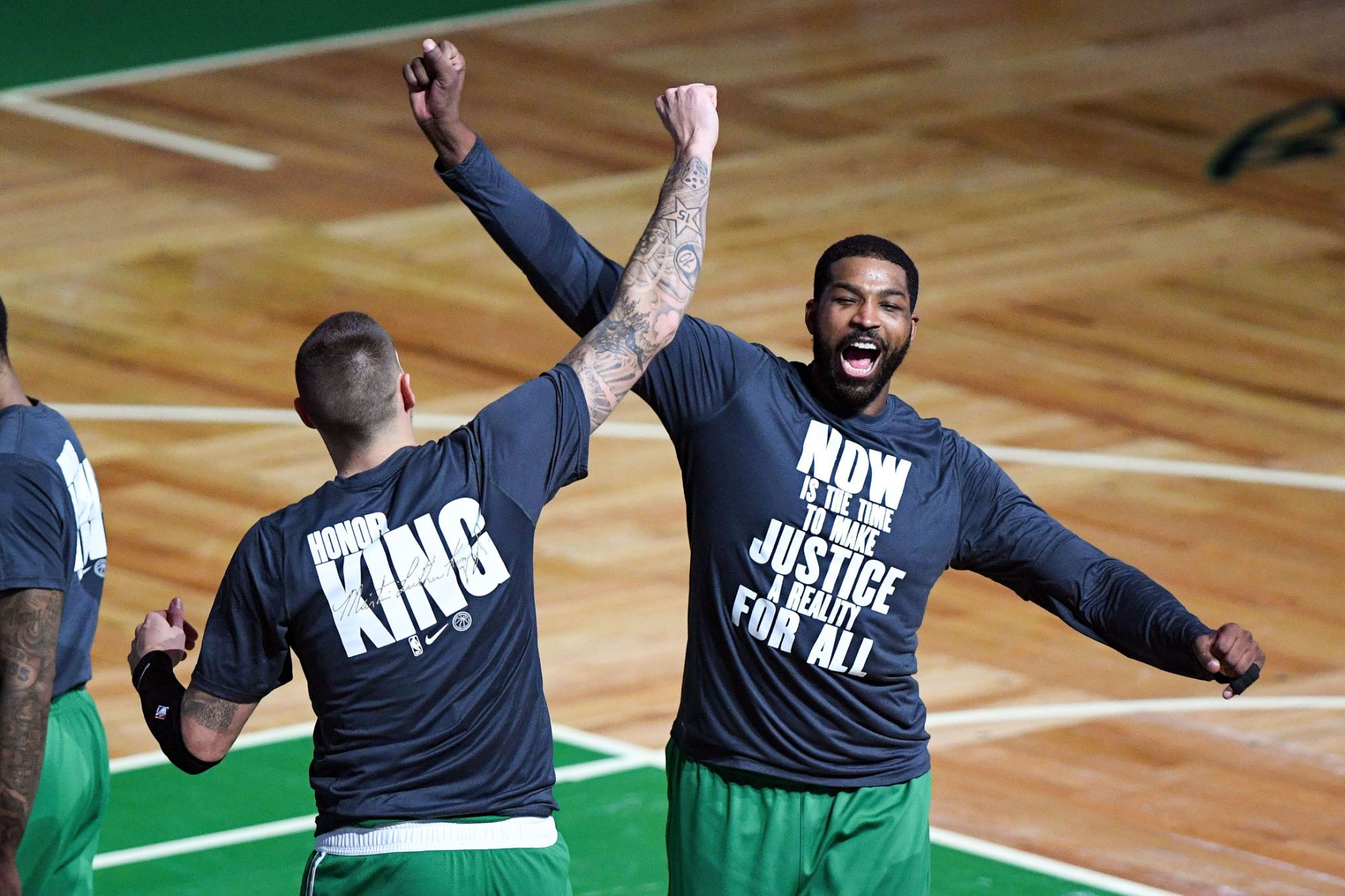 Jan 15, 2021; Boston, Massachusetts, USA; Boston Celtics forward Tristan Thompson (13) high-fives enter Daniel Theis (27) during player introductions before a game against the Orlando Magic at the TD Garden. Mandatory Credit: Brian Fluharty-USA TODAY Sports