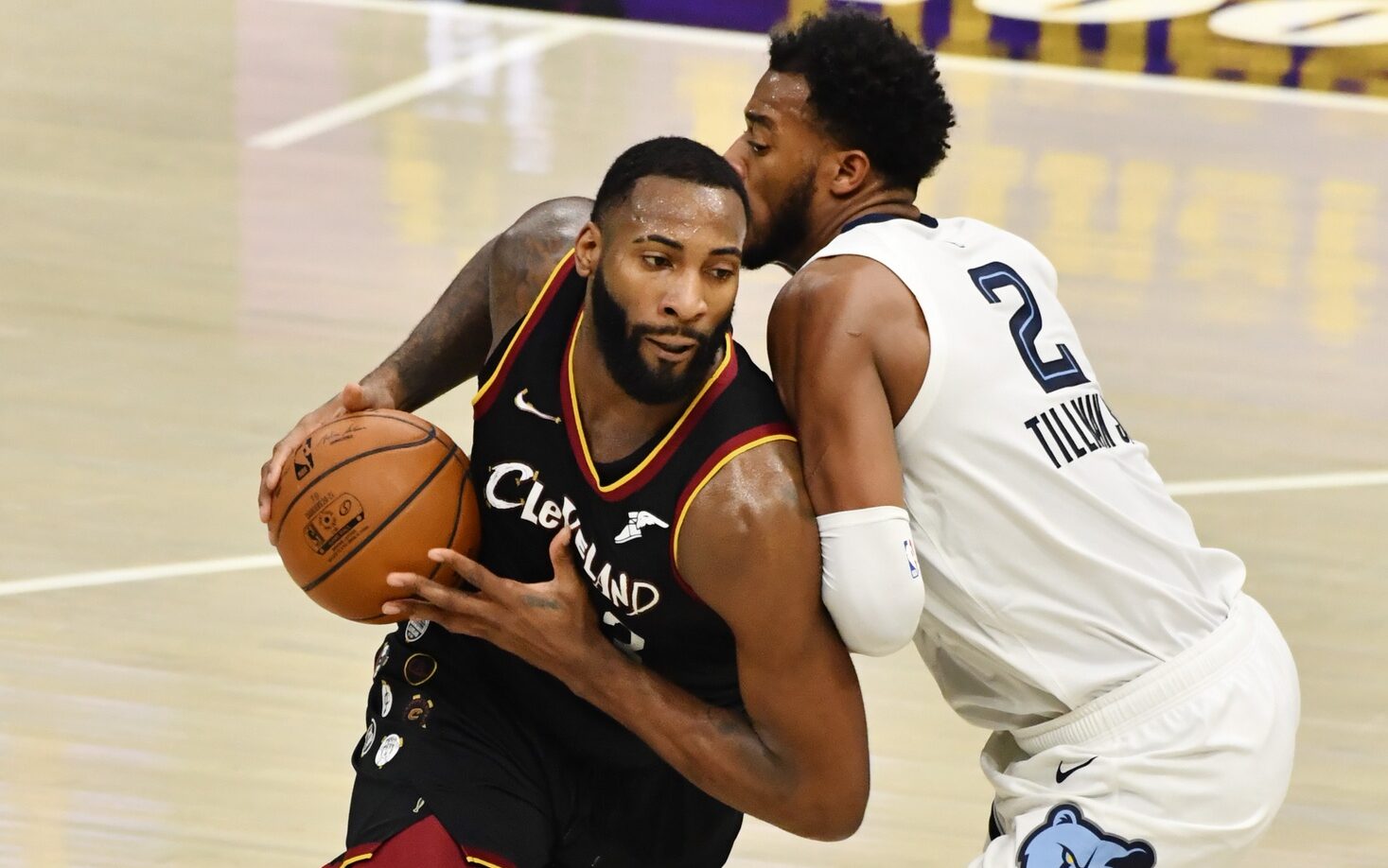 Jan 11, 2021; Cleveland, Ohio, USA; Cleveland Cavaliers center Andre Drummond (3) dribbles the ball while defended by Memphis Grizzlies forward Xavier Tillman (2) during the second quarter at Rocket Mortgage FieldHouse. Mandatory Credit: Ken Blaze-USA TODAY Sports