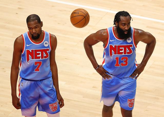 ATLANTA, GEORGIA - JANUARY 27: Kevin Durant #7 and James Harden #13 of the Brooklyn Nets react after the Atlanta Hawks drew a foul during the first half at State Farm Arena on January 27, 2021 in Atlanta, Georgia. NOTE TO USER: User expressly acknowledges and agrees that, by downloading and or using this photograph, User is consenting to the terms and conditions of the Getty Images License Agreement. (Photo by Kevin C. Cox/Getty Images)