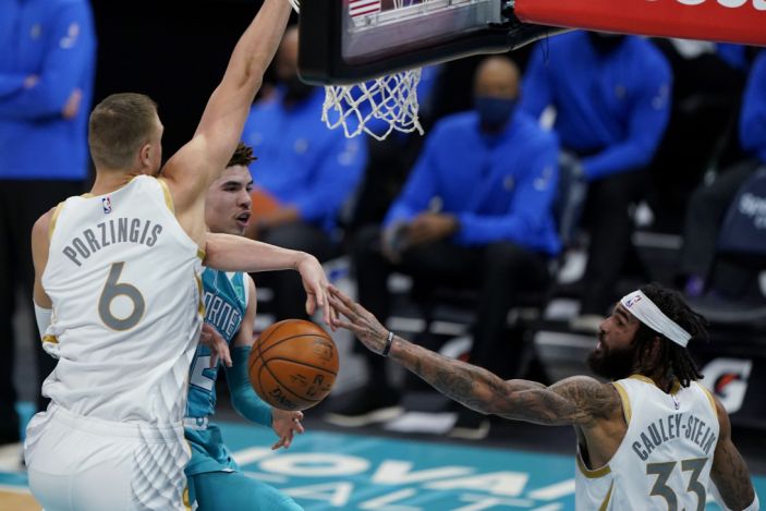 Doncic has 34 points, Mavs beat Hornets in Porzingis' return