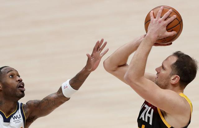 DENVER, COLORADO - JANUARY 31: Bojan Bogdanovic #44 of the Utah Jazz puts up a shot over Will Barton #5 of the Denver Nuggets in the second quarter at Ball Arena on January 31, 2021 in Denver, Colorado. NOTE TO USER: User expressly acknowledges and agrees that, by downloading and or using this photograph, User is consenting to the terms and conditions of the Getty Images License Agreement. (Photo by Matthew Stockman/Getty Images)