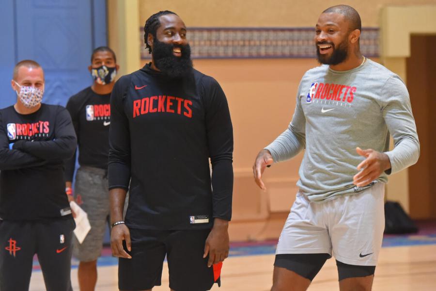 ORLANDO, FL - JULY 16: James Harden #13 and P.J. Tucker #17 of the Houston Rockets smile and laugh during practice as part of the NBA Restart 2020 on July 16, 2020 in Orlando, Florida. NOTE TO USER: User expressly acknowledges and agrees that, by downloading and/or using this photograph, user is consenting to the terms and conditions of the Getty Images License Agreement. Mandatory Copyright Notice: Copyright 2020 NBAE (Photo by Bill Baptist/NBAE via Getty Images)