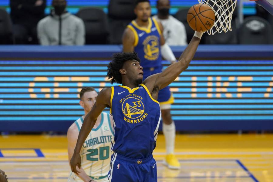 Golden State Warriors center James Wiseman (33) against the Charlotte Hornets during an NBA basketball game in San Francisco, Friday, Feb. 26, 2021. (AP Photo/Jeff Chiu)