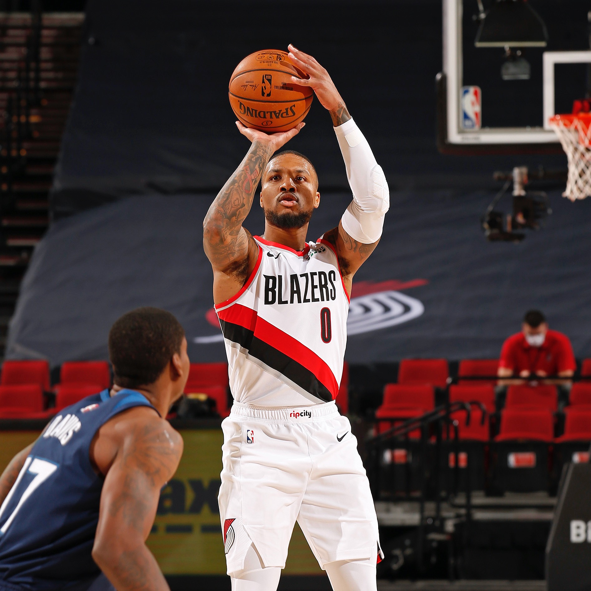 PORTLAND, OR - JANUARY 7: Damian Lillard #0 of the Portland Trail Blazers shoots a three point basket against the Minnesota Timberwolves on January 7, 2021 at the Moda Center Arena in Portland, Oregon. NOTE TO USER: User expressly acknowledges and agrees that, by downloading and or using this photograph, user is consenting to the terms and conditions of the Getty Images License Agreement. Mandatory Copyright Notice: Copyright 2021 NBAE (Photo by Cameron Browne/NBAE via Getty Images)