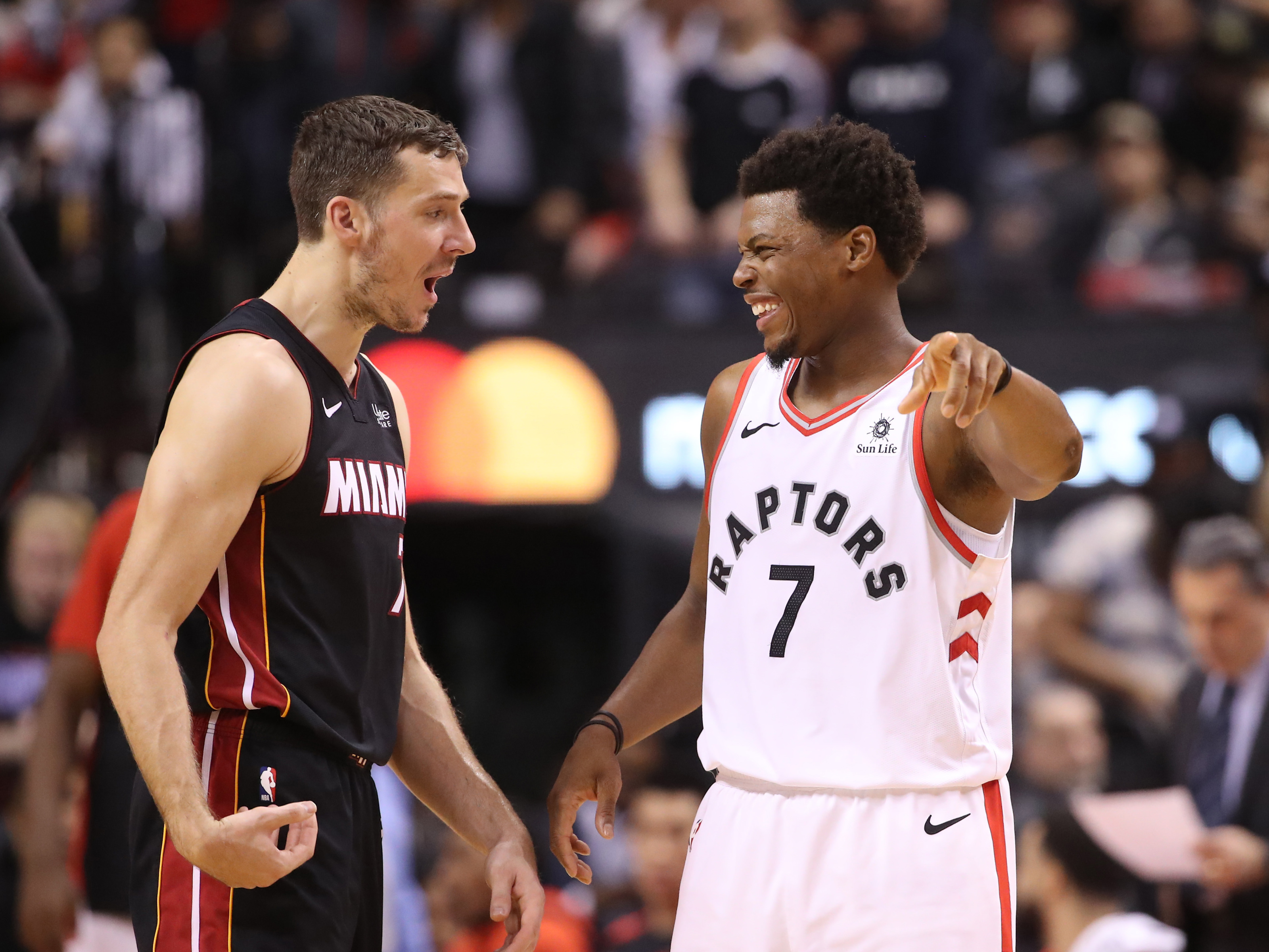 TORONTO, ON - APRIL 07: Kyle Lowry #7 (R) of the Toronto Raptors shares a laugh with Goran Dragic #7 (L) of the Miami Heat at Scotiabank Arena on April 7, 2019 in Toronto, Canada. NOTE TO USER: User expressly acknowledges and agrees that, by downloading and or using this photograph, User is consenting to the terms and conditions of the Getty Images License Agreement. (Photo by Tom Szczerbowski/Getty Images)
