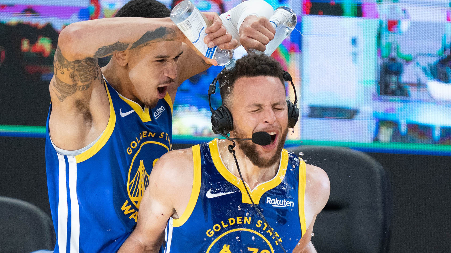April 12, 2021; San Francisco, California, USA; Golden State Warriors forward Juan Toscano-Anderson (95) pours water on guard Stephen Curry (30) after the game against the Denver Nuggets at Chase Center. Mandatory Credit: Kyle Terada-USA TODAY Sports