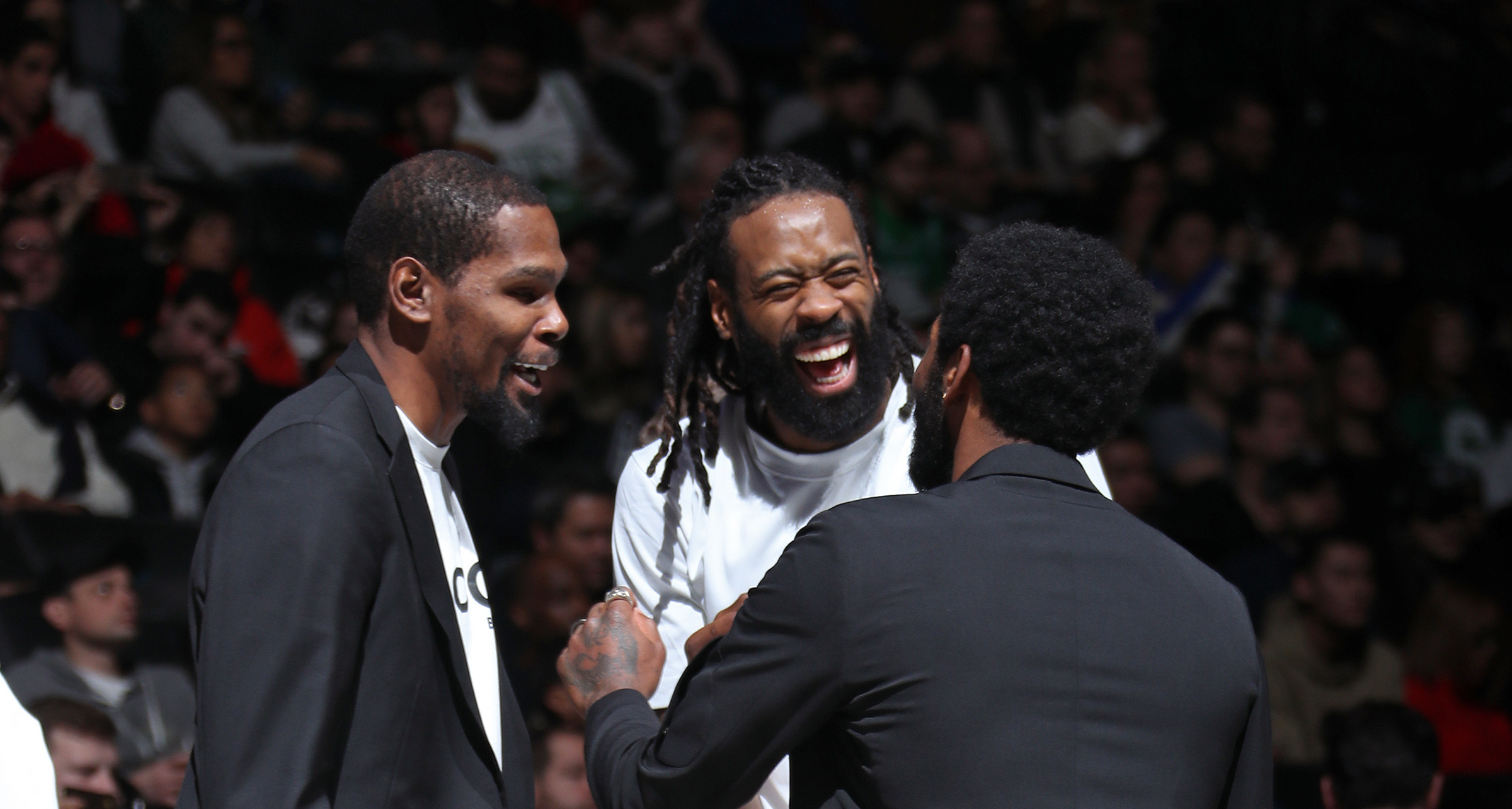 BROOKLYN, NY - NOVEMBER 29: Kevin Durant #7, DeAndre Jordan #6 and Kyrie Irving #11 of the Brooklyn Nets smile and laugh during the game against the Boston Celtics on November 29, 2019 at Barclays Center in Brooklyn, New York. NOTE TO USER: User expressly acknowledges and agrees that, by downloading and or using this photograph, User is consenting to the terms and conditions of the Getty Images License Agreement. Mandatory Copyright Notice: Copyright 2019 NBAE (Photo by Nathaniel S. Butler/NBAE via Getty Images)