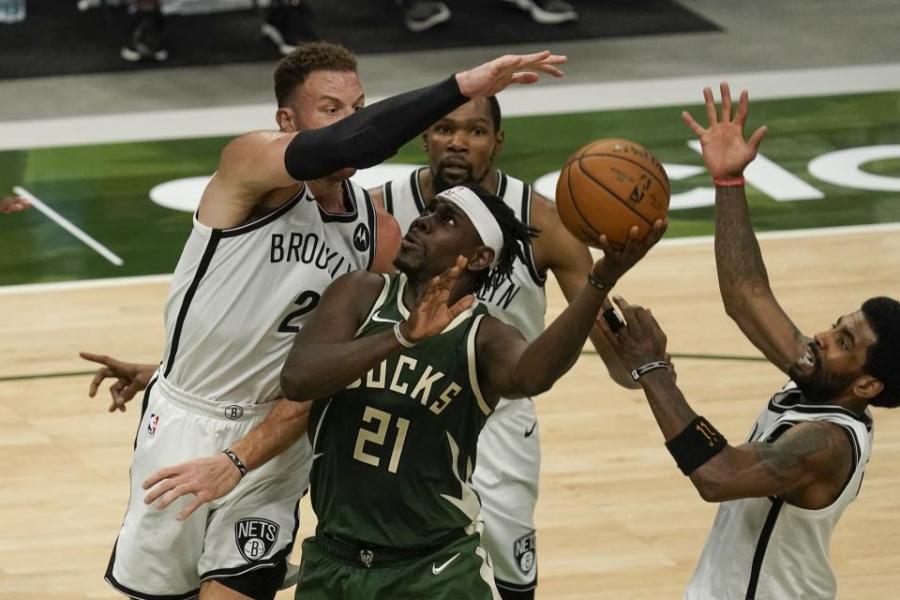 Antetokounmpo scores 49 points as Bucks beat Nets 117-114