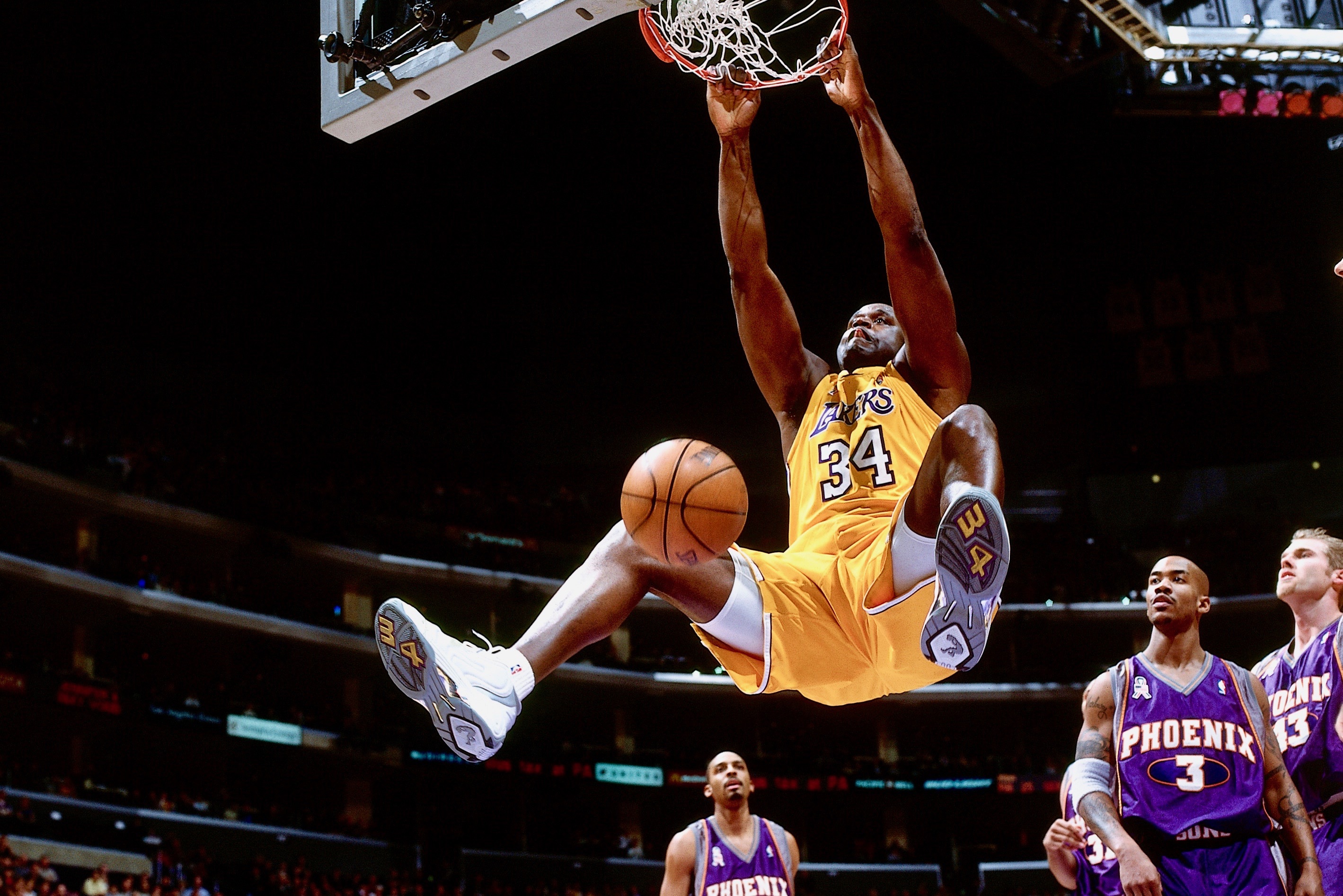 LOS ANGELES - 2004: Shaquille O'Neal #34 of the Los Angeles Lakers dunks against the Phoenix Suns during an NBA game circa 2004 at the Staples Center in Los Angeles, California. NOTE TO USER: User expressly acknowledges and agrees that, by downloading and/or using this Photograph, User is consenting to the terms and conditions of the Getty Images License Agreement. Mandatory Copyright Notice: Copyright 2004 NBAE (Photo by Andrew D. Bernstein/NBAE via Getty Images)