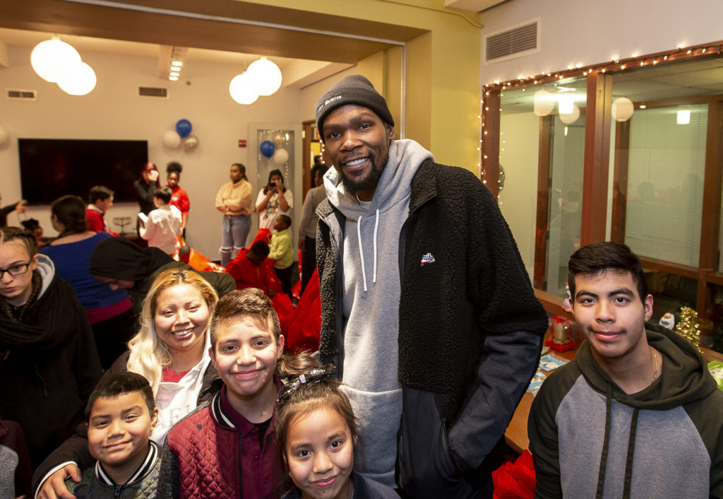 NEW YORK, NY - DECEMBER 19: Kevin Durant gives the CFTH’s Bound for Success program, which provides tutoring, homework help, and recreational and cultural activities every weekday for homeless youth ages 6 to 13 a special holiday surprise at the Coalition for the Homeless on December 19, 2019 at Coalition for the Homeless in New York, NY (Photo by Michelle Farsi)