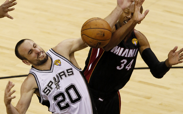Jun 13, 2013; San Antonio, TX, USA; Miami Heat shooting guard Ray Allen (34) blocks a shot by San Antonio Spurs shooting guard Manu Ginobili (20 during the fourth quarter of game four of the 2013 NBA Finals at the AT&T Center. The Heat defeated the Spurs 109-93. Mandatory Credit: Soobum Im-USA TODAY Sports