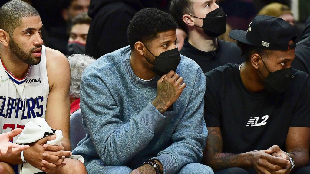 Dec 26, 2021; Los Angeles, California, USA; Los Angeles Clippers center Ivica Zubac (40) forward Nicolas Batum (33) guard Paul George and forward Kawhi Leonard watch game action against the Denver Nuggets during the second half at Crypto.com Arena. Mandatory Credit: Gary A. Vasquez-USA TODAY Sports