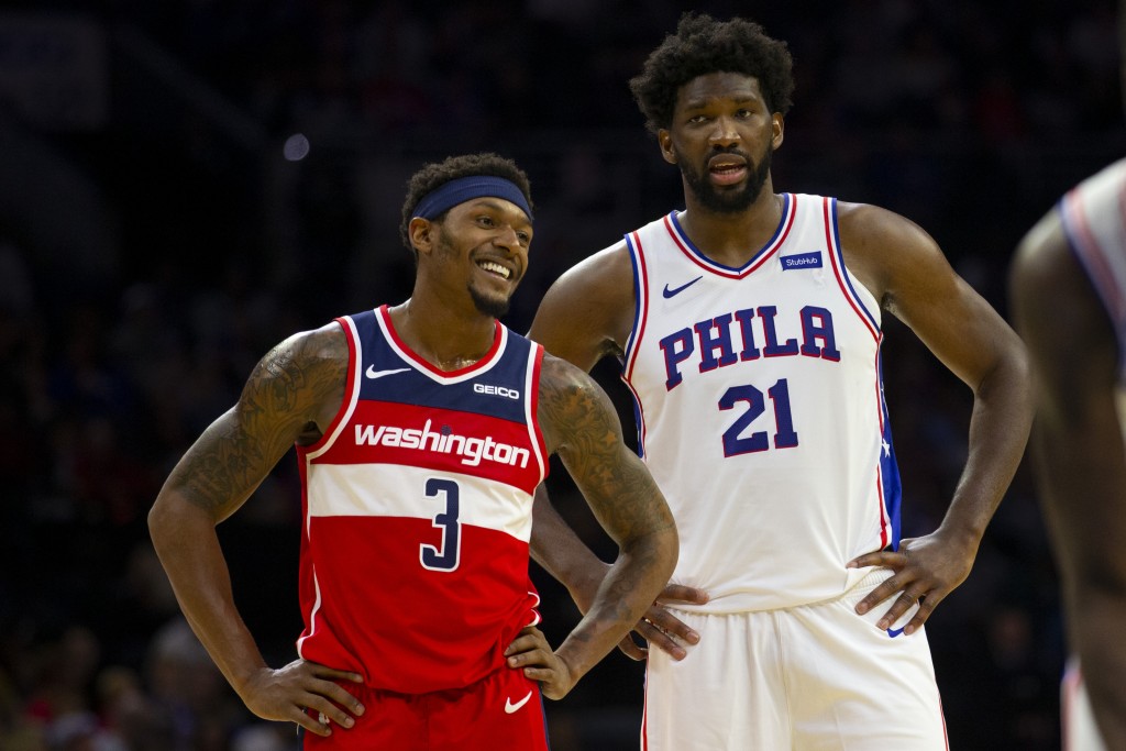 PHILADELPHIA, PA - OCTOBER 18: Bradley Beal #3 of the Washington Wizards talks to Joel Embiid #21 of the Philadelphia 76ers during the preseason game at the Wells Fargo Center on October 18, 2019 in Philadelphia, Pennsylvania. NOTE TO USER: User expressly acknowledges and agrees that, by downloading and or using this photograph, User is consenting to the terms and conditions of the Getty Images License Agreement.(Photo by Mitchell Leff/Getty Images)