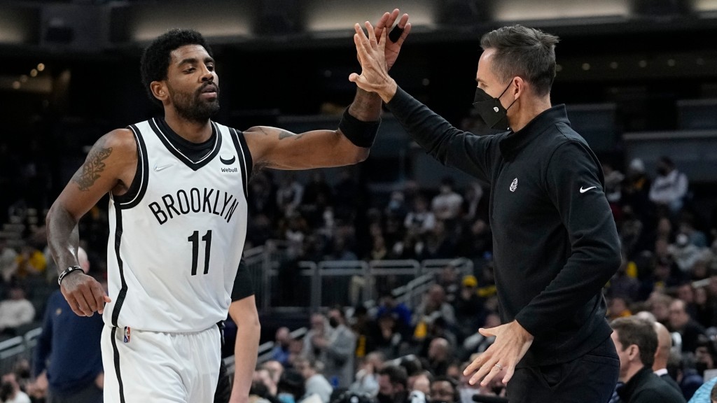 Brooklyn Nets head coach Steve Nash reacts with Kyrie Irving during the second half of an NBA basketball game against the Indiana Pacers, Wednesday, Jan. 5, 2022, in Indianapolis. (AP Photo/Darron Cummings)