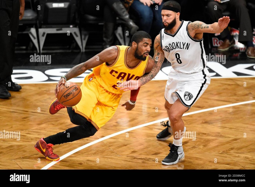 cleveland-cavaliers-guard-kyrie-irving-2-drives-past-brooklyn-nets-guard-deron-williams-8-in-the-first-half-at-barclays-center-in-new-york-city-on-2D38MCC