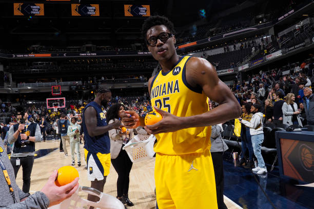 INDIANAPOLIS, IN - APRIL 5: Jalen Smith #25 of the Indiana Pacers signs a ball after the game against the Philadelphia 76ers on April 5, 2022 at Gainbridge Fieldhouse in Indianapolis, Indiana. NOTE TO USER: User expressly acknowledges and agrees that, by downloading and or using this Photograph, user is consenting to the terms and conditions of the Getty Images License Agreement. Mandatory Copyright Notice: Copyright 2022 NBAE (Photo by Ron Hoskins/NBAE via Getty Images)